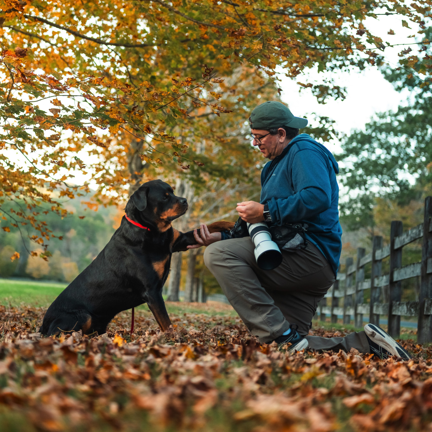 Dave Breen interacting with a dog during a photo session